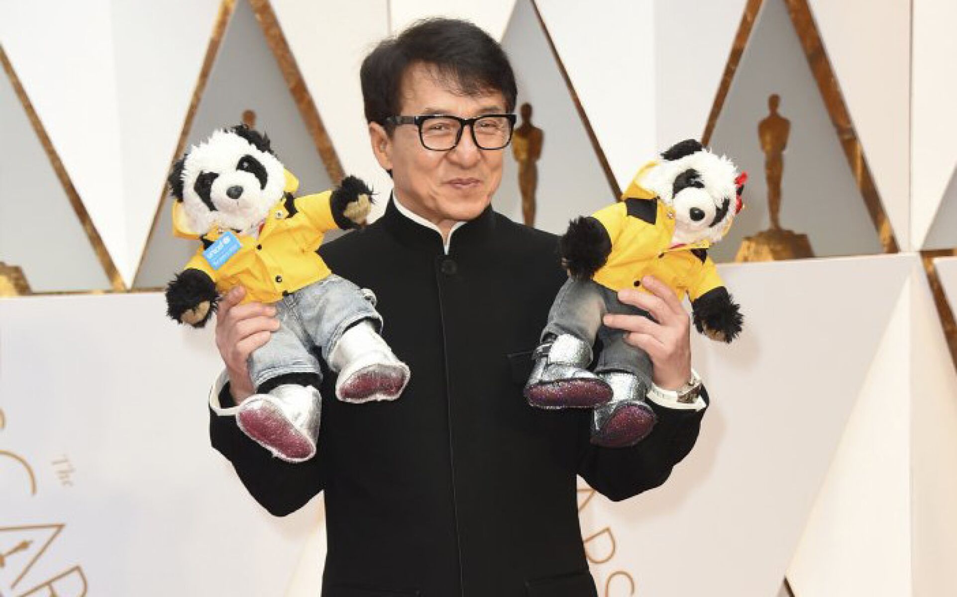Jackie Chan arrives at the Oscars.